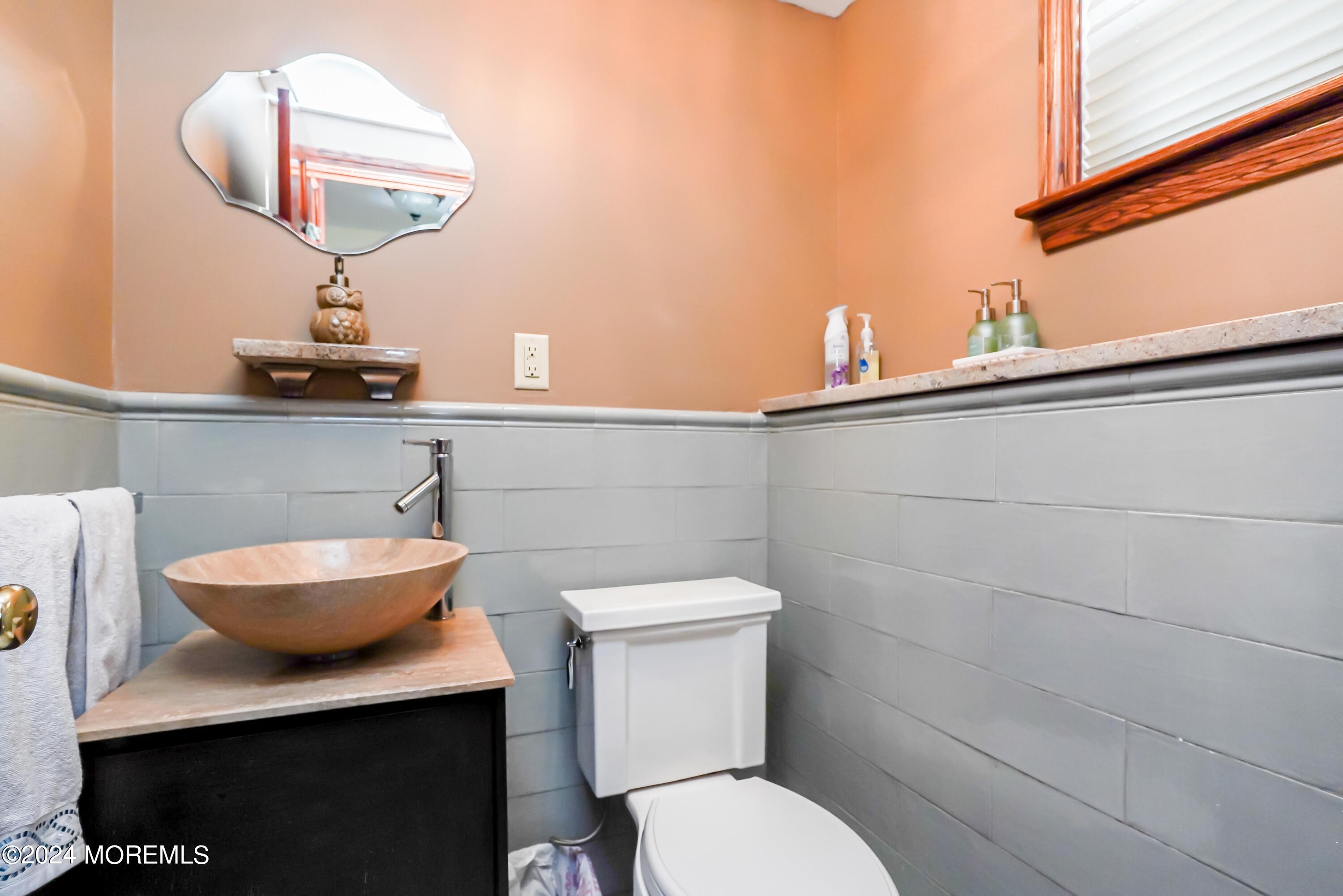 45 Center Road Randolph, NJ 07869 - Photo 33 of 43 a bathroom with a toilet a sink and a window