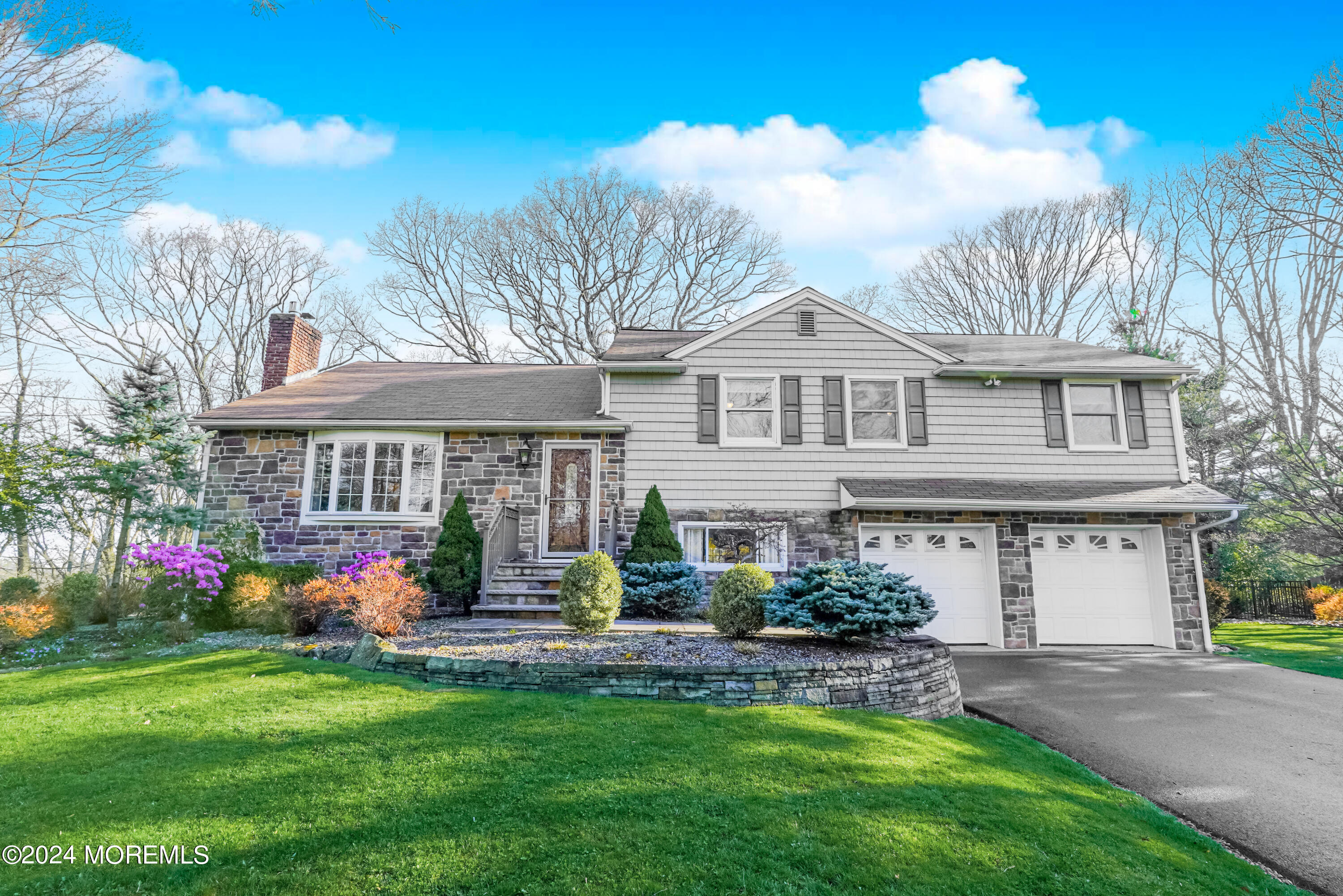 45 Center Road Randolph, NJ 07869 - Photo 43 of 43 a front view of a house with a garden and plants