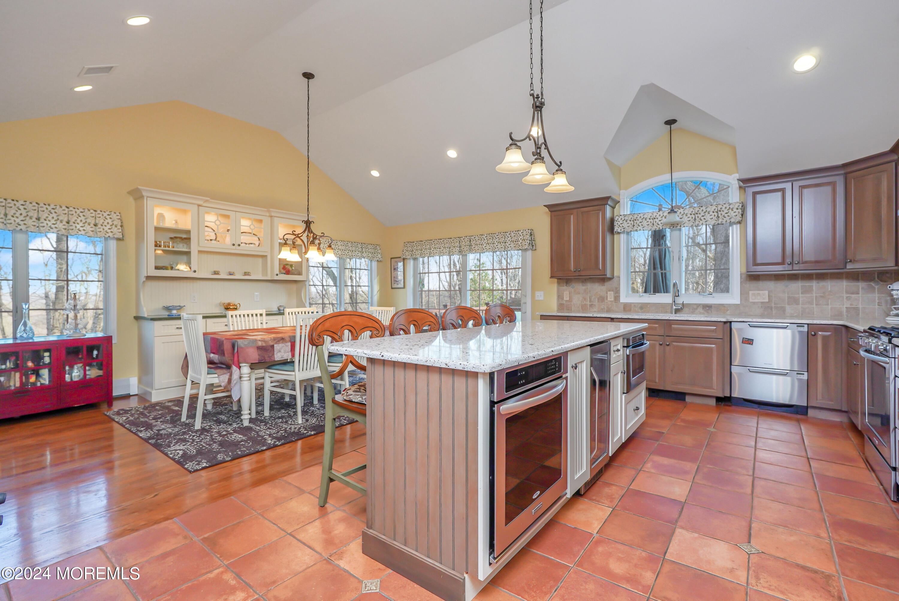 45 Center Road Randolph, NJ 07869 - Photo 10 of 43 a kitchen with stainless steel appliances granite countertop a stove a sink a oven a dining table and chairs