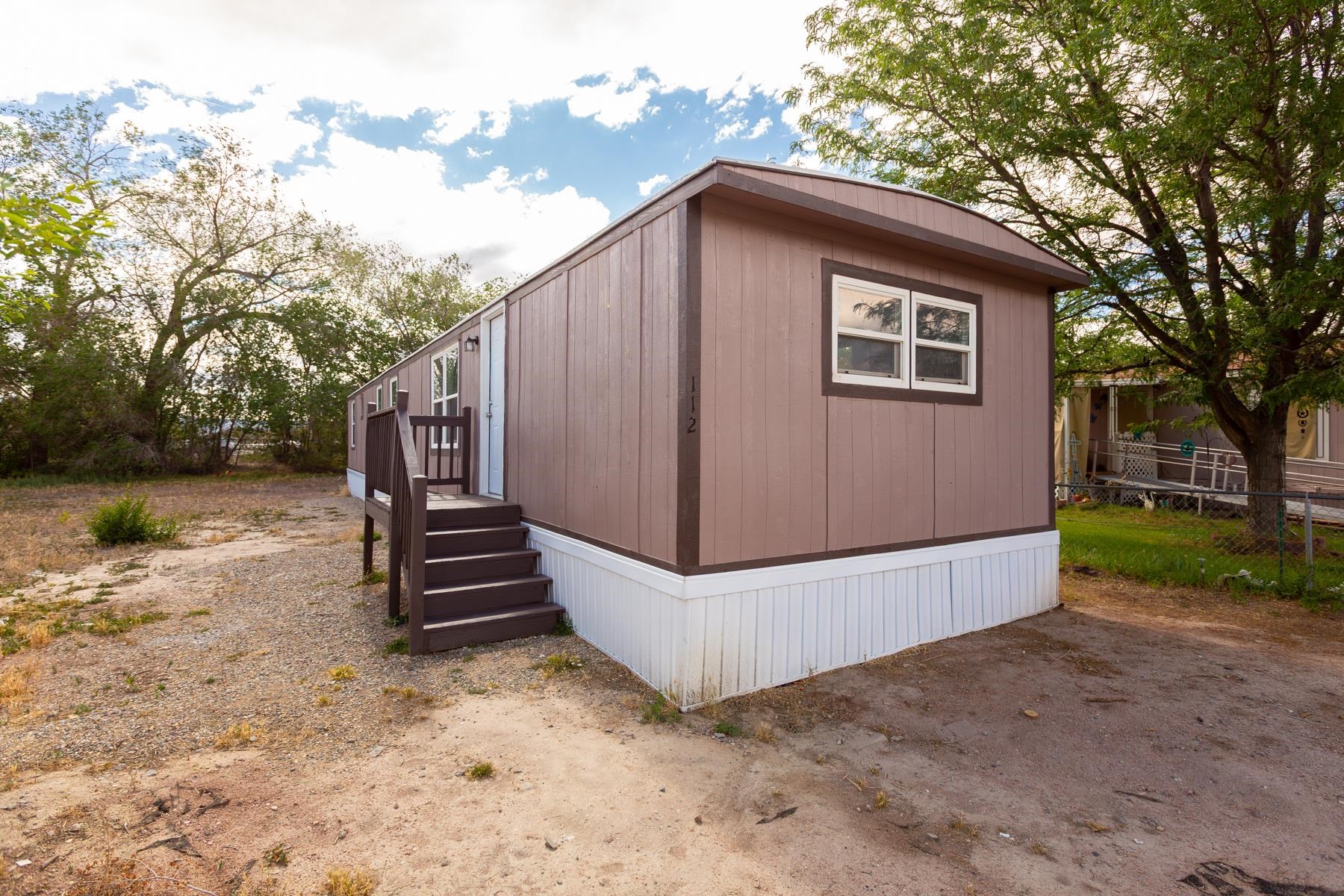 424 32 Road, Unit 112 Clifton, CO 81520 - Photo 3 of 41 a view of a house with a yard