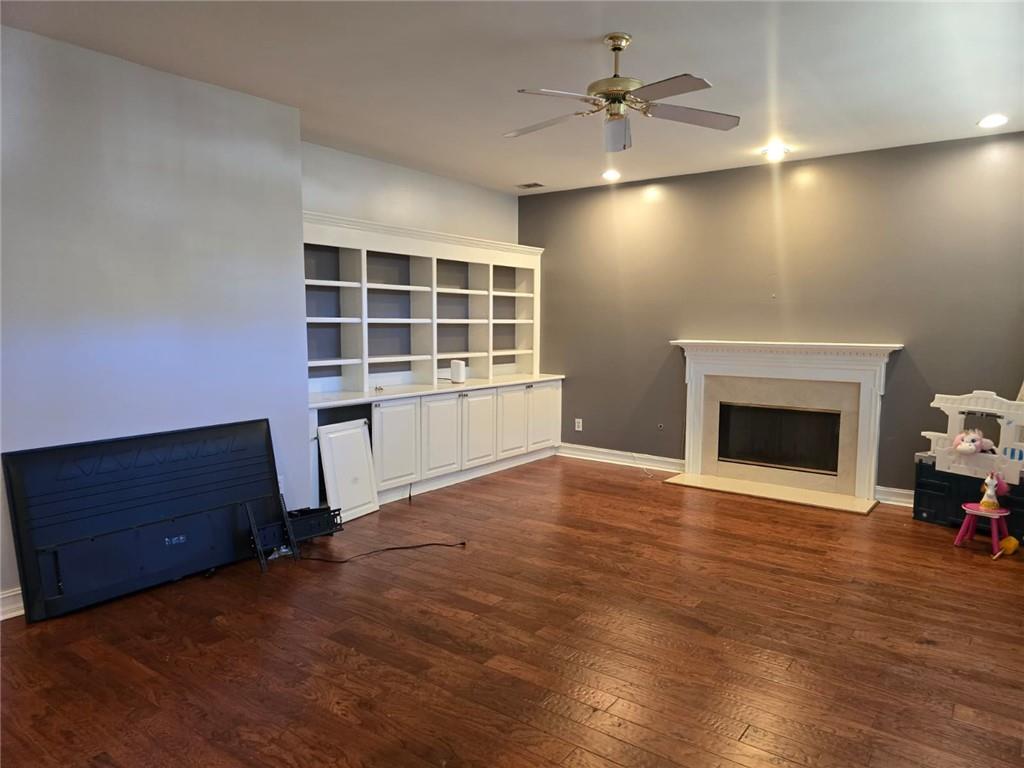 232 Spalding Gates Drive Northeast Atlanta, GA 30328 - Photo 6 of 12 a view of an empty room with a fireplace and a window