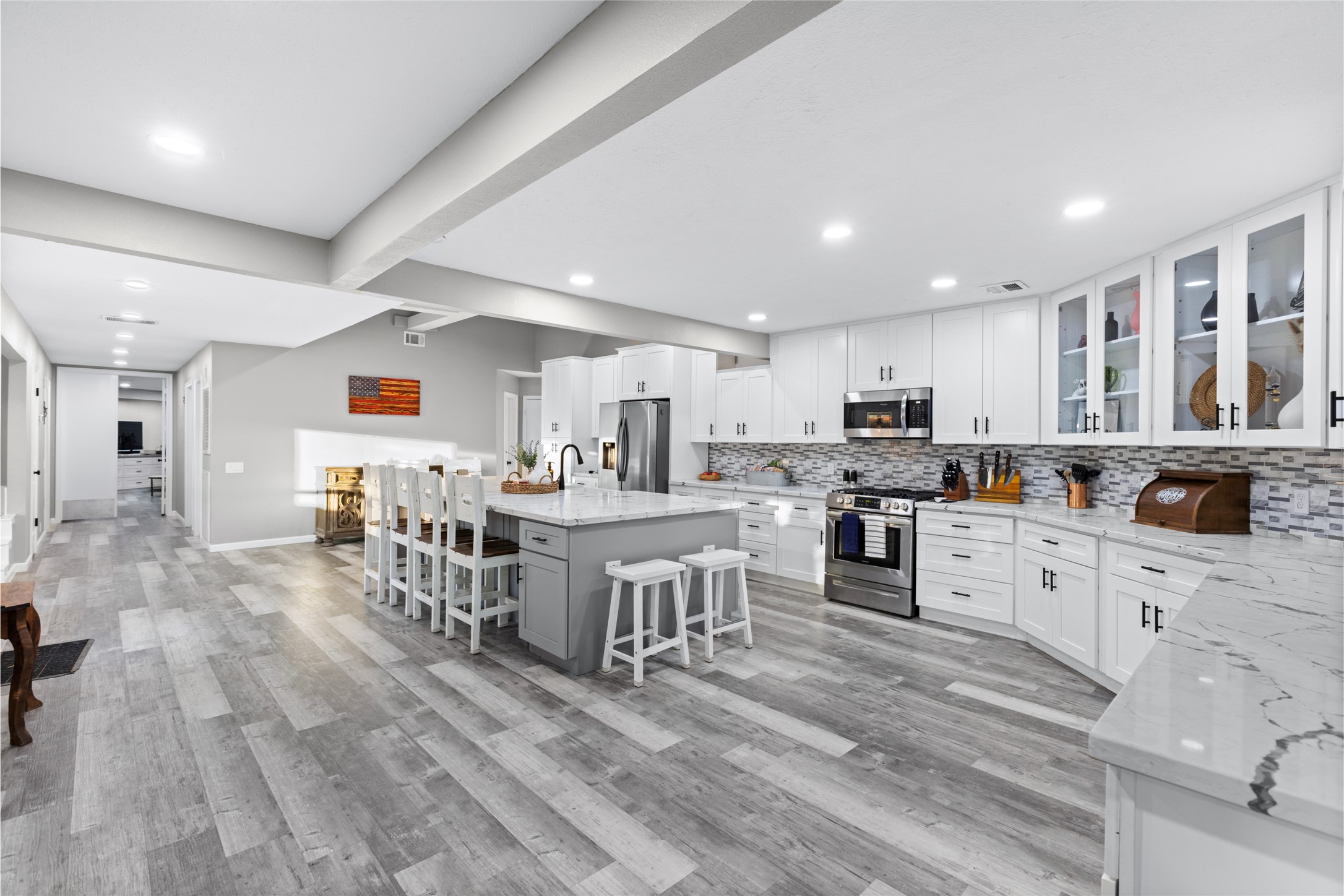 1824 Pine Cone Katy, TX 77493 - Photo 11 of 50 a kitchen with lots of counter top space and furniture