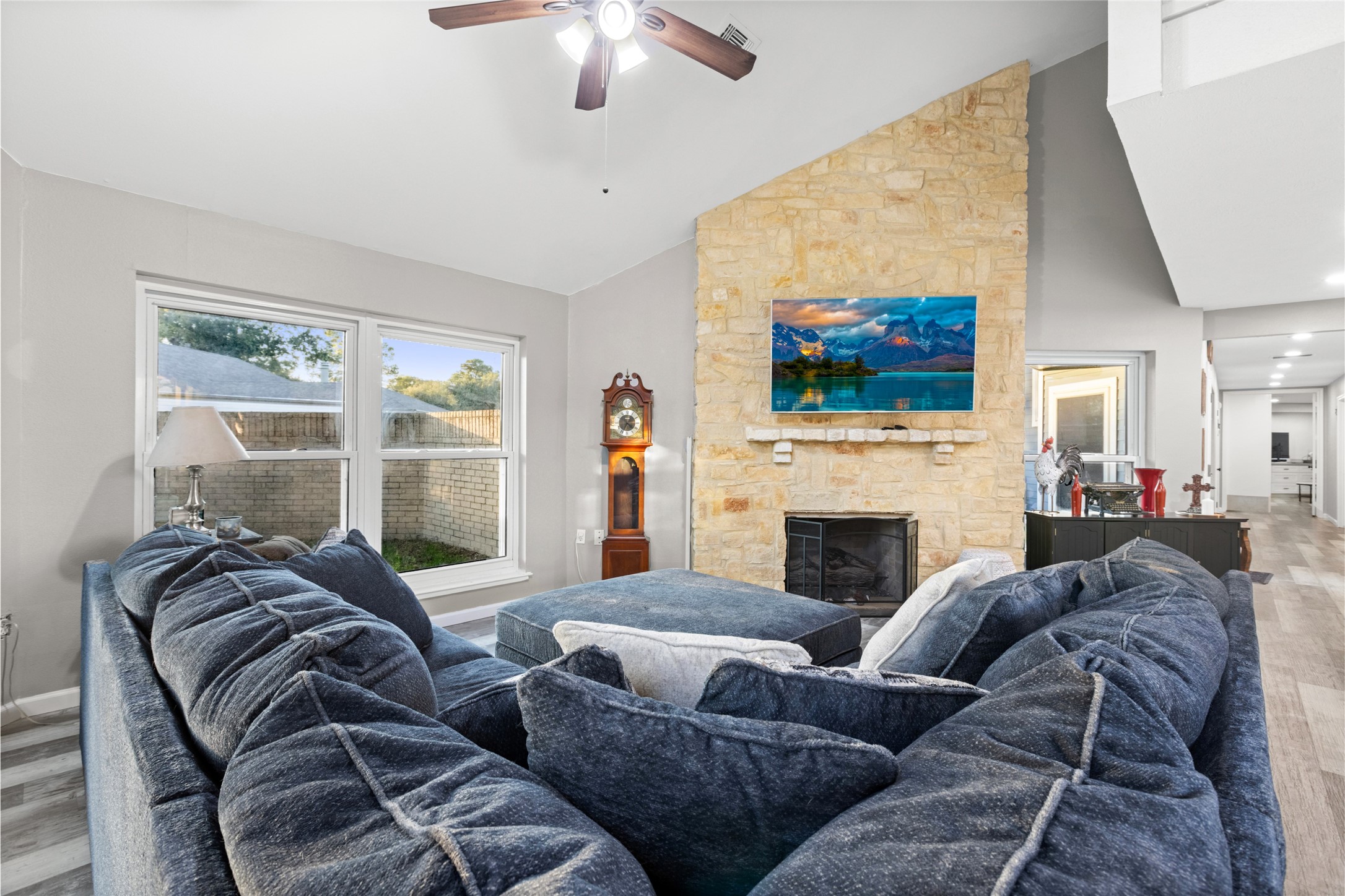 1824 Pine Cone Katy, TX 77493 - Photo 17 of 50 a living room with furniture a flat screen tv and a fireplace