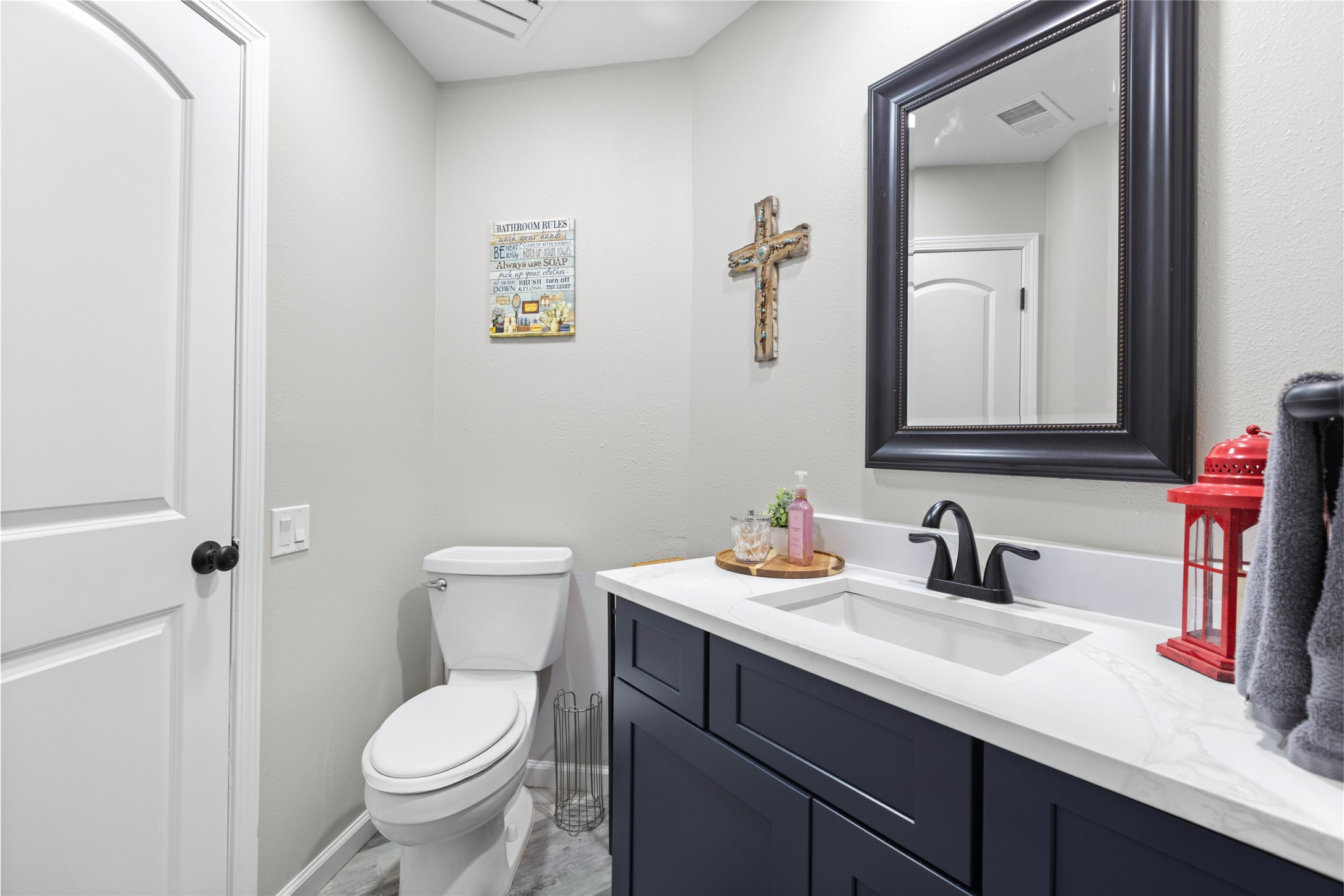 1824 Pine Cone Katy, TX 77493 - Photo 19 of 50 a bathroom with a toilet sink and mirror