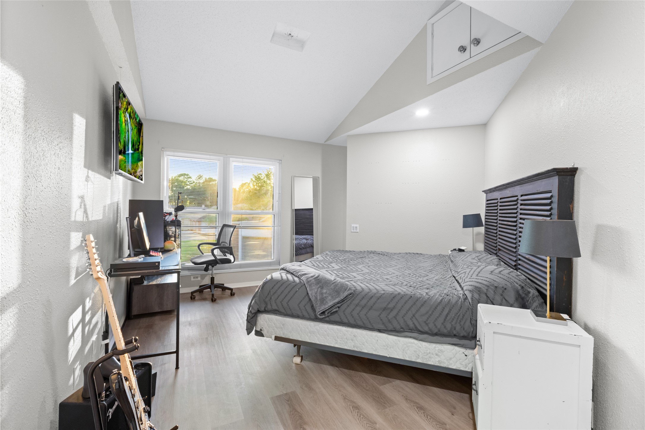 1824 Pine Cone Katy, TX 77493 - Photo 33 of 50 a bedroom with a bed gym equipment and a large window