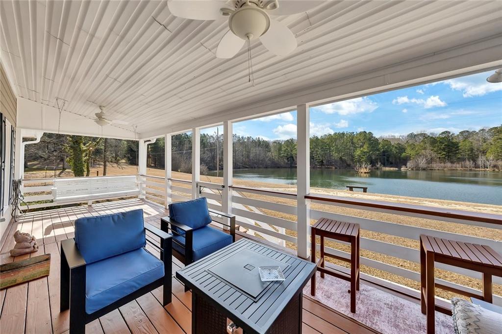 2133 Mann Road Douglasville, GA 30134 - Photo 12 of 69 a living room with furniture and a floor to ceiling window
