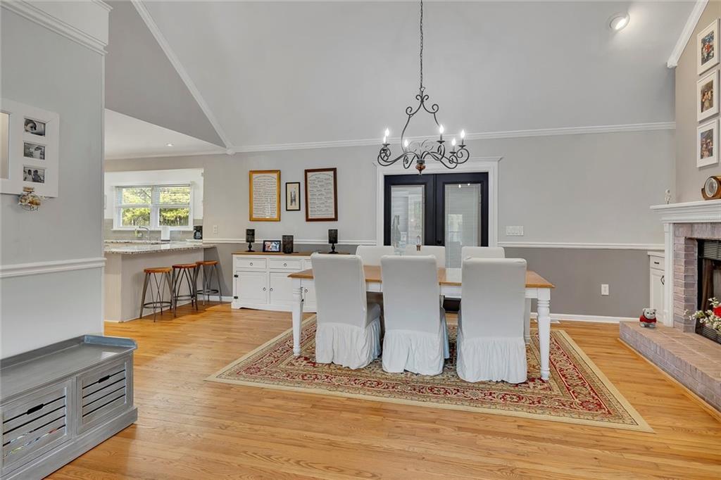 2133 Mann Road Douglasville, GA 30134 - Photo 20 of 69 a living room with fireplace furniture and a chandelier