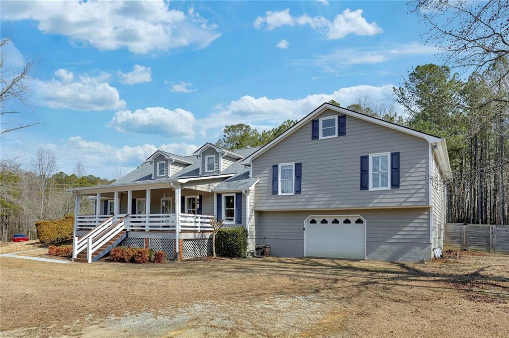 2133 Mann Road Douglasville, GA 30134 - Photo 2 of 69 a front view of a house with a yard
