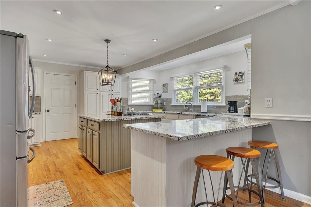 2133 Mann Road Douglasville, GA 30134 - Photo 24 of 69 a kitchen with stainless steel appliances granite countertop a sink and a refrigerator