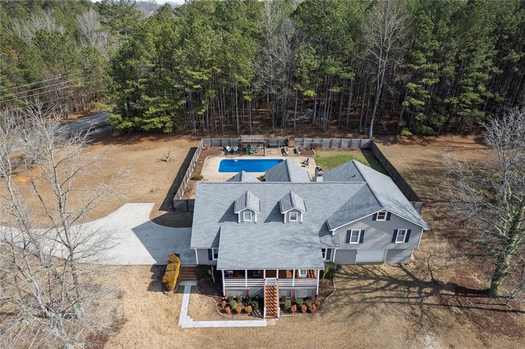 2133 Mann Road Douglasville, GA 30134 - Photo 3 of 69 an aerial view of a house with swimming pool and sitting area