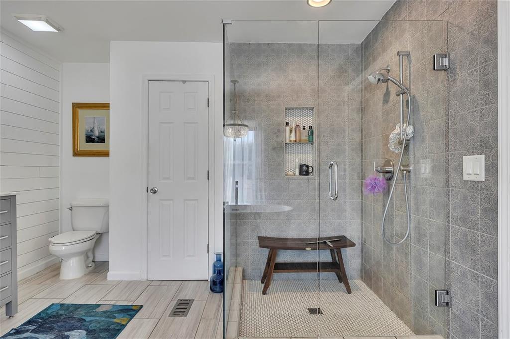 2133 Mann Road Douglasville, GA 30134 - Photo 37 of 69 a bathroom with a shower and a toilet