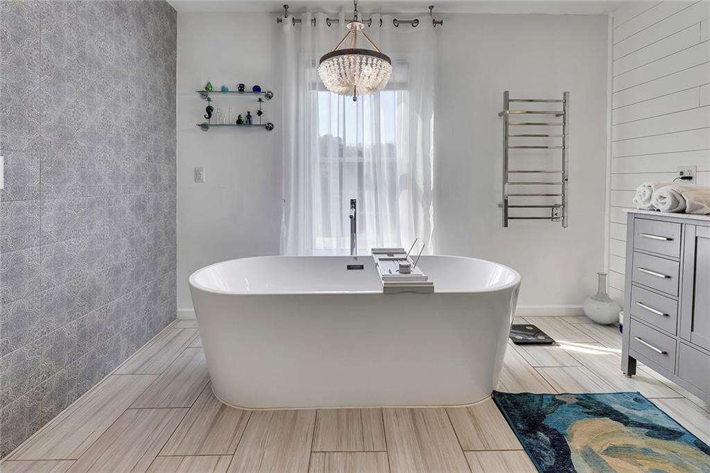 2133 Mann Road Douglasville, GA 30134 - Photo 38 of 69 a view of a bathroom with a sink and mirror