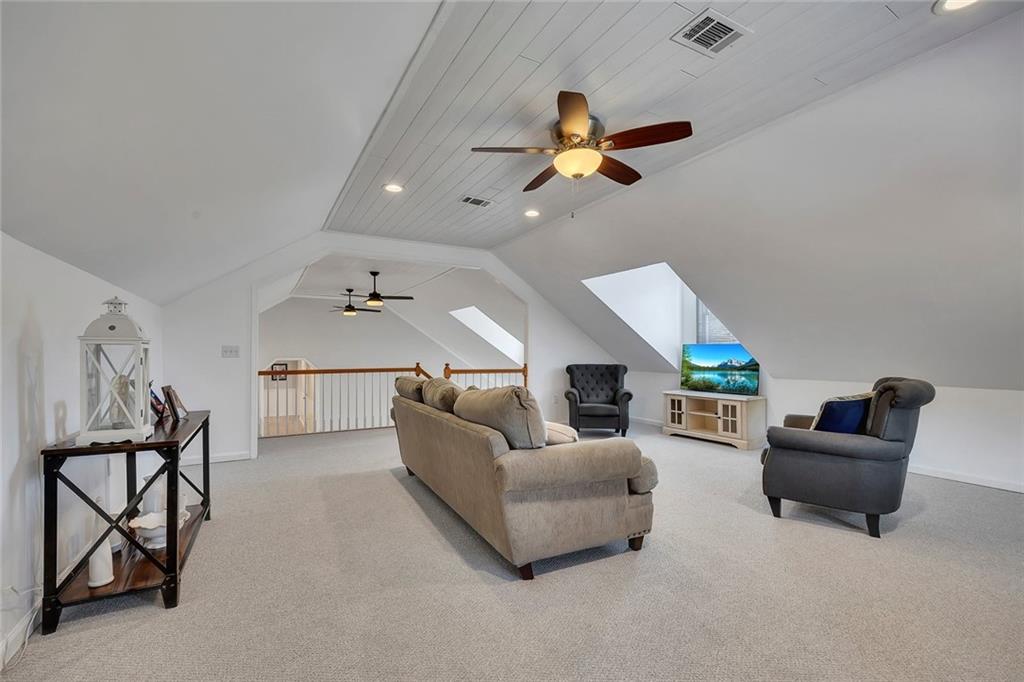 2133 Mann Road Douglasville, GA 30134 - Photo 43 of 69 a living room with furniture and a ceiling fan