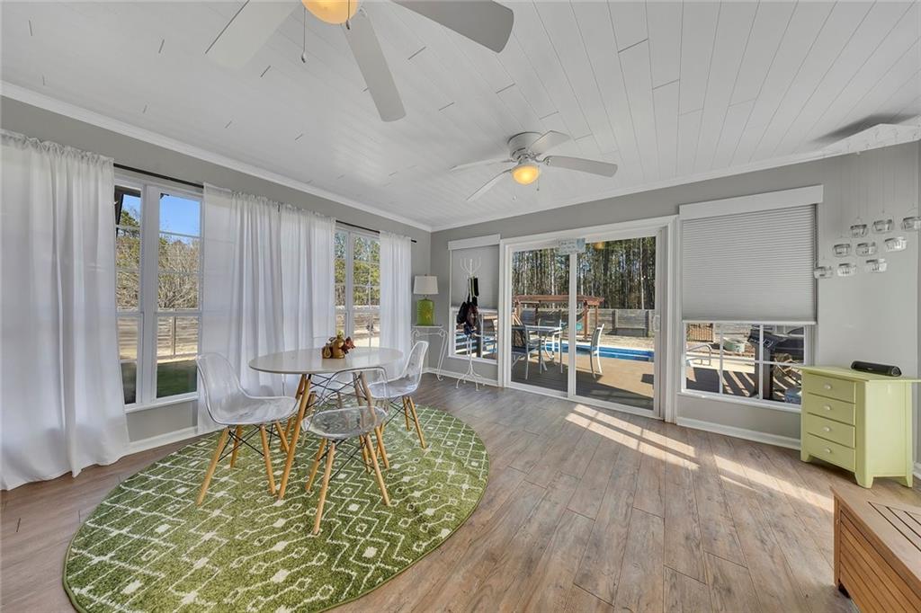 2133 Mann Road Douglasville, GA 30134 - Photo 44 of 69 a living room with furniture windows and wooden floor