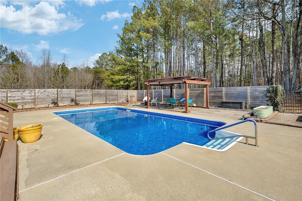 2133 Mann Road Douglasville, GA 30134 - Photo 52 of 69 a view of a swimming pool with an outdoor seating