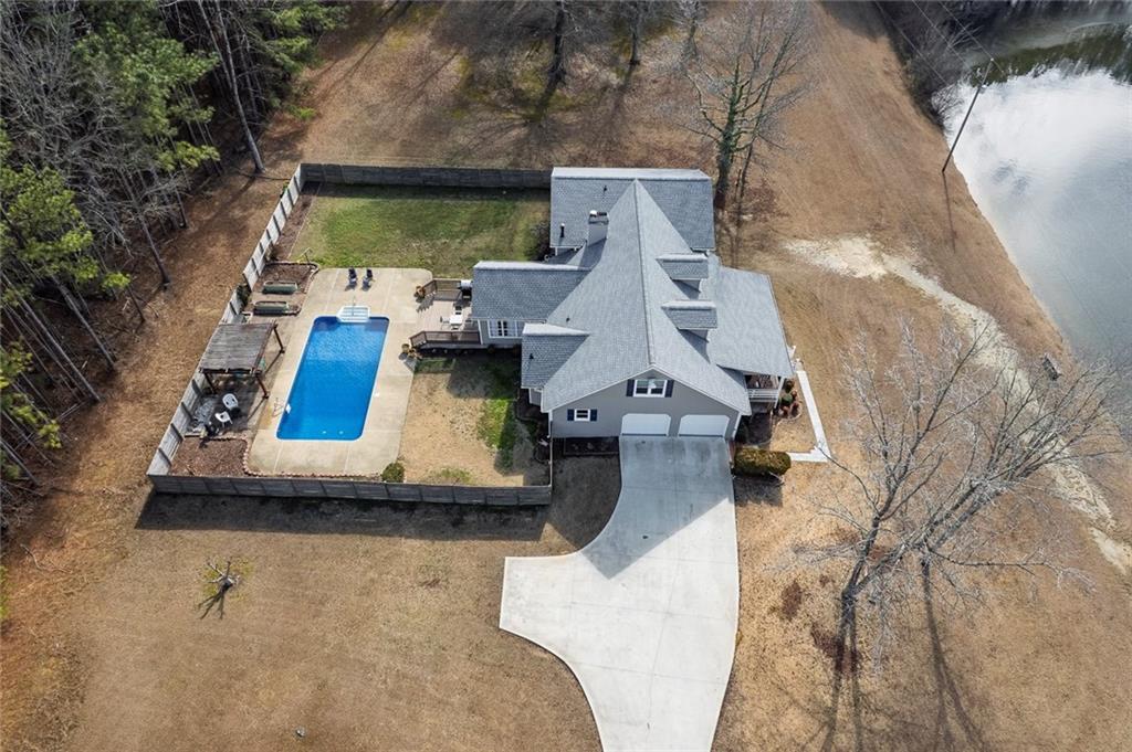 2133 Mann Road Douglasville, GA 30134 - Photo 68 of 69 an aerial view of a house with a yard and balcony