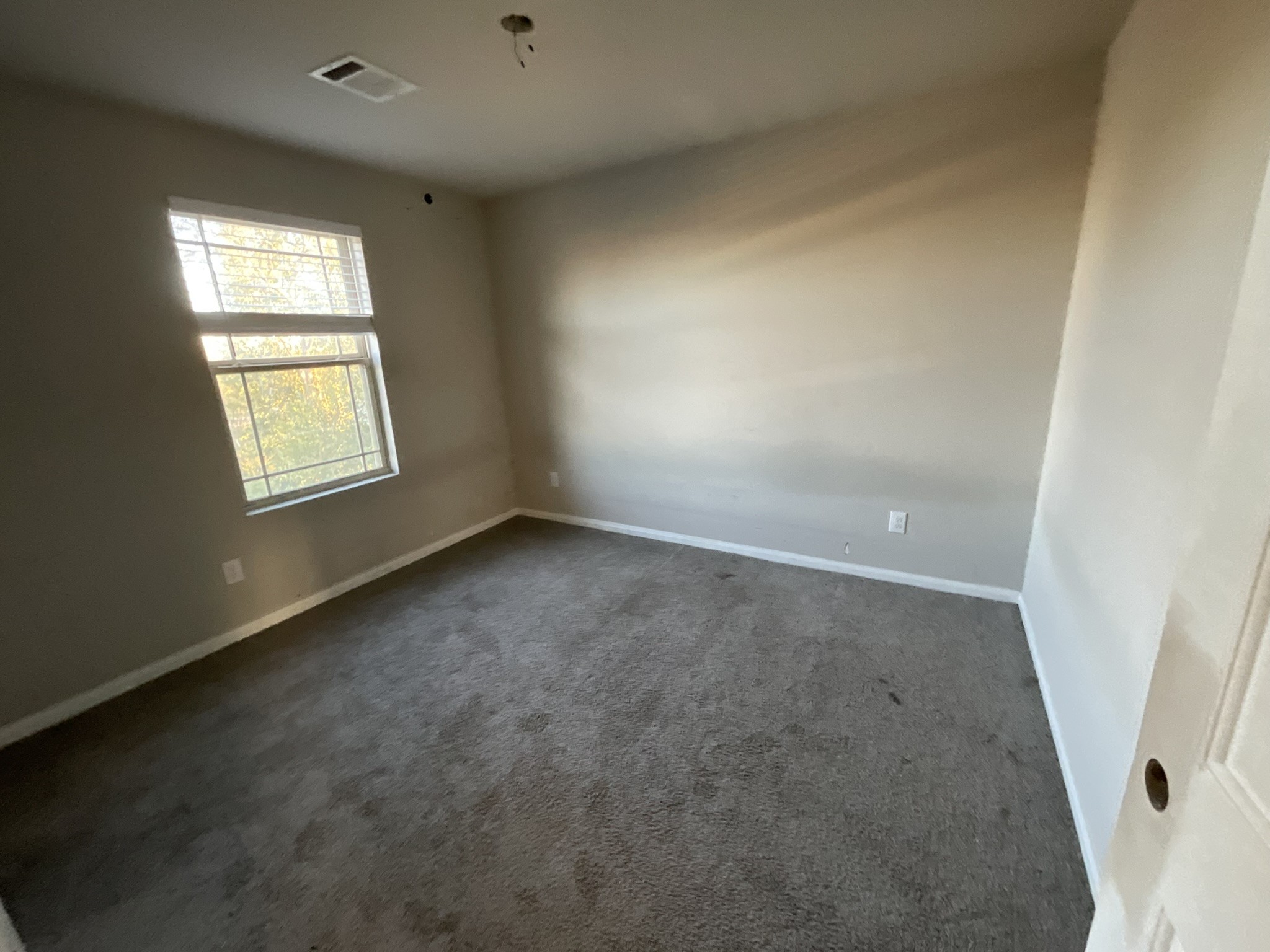 803 North Spanish Camp Road Wharton, TX 77488 - Photo 9 of 13 an empty room with a window