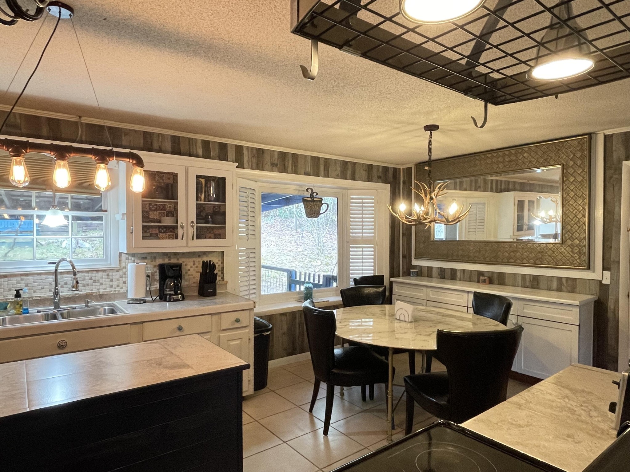 1522 Turkey Creek Road Tellico Plains, TN 37385 - Photo 26 of 34 a kitchen with a counter space a sink stainless steel appliances and cabinets