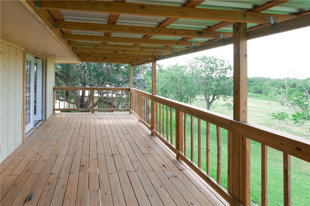 155 Buffalo Road George West, TX 78022 - Photo 12 of 39 a view of balcony with wooden floor