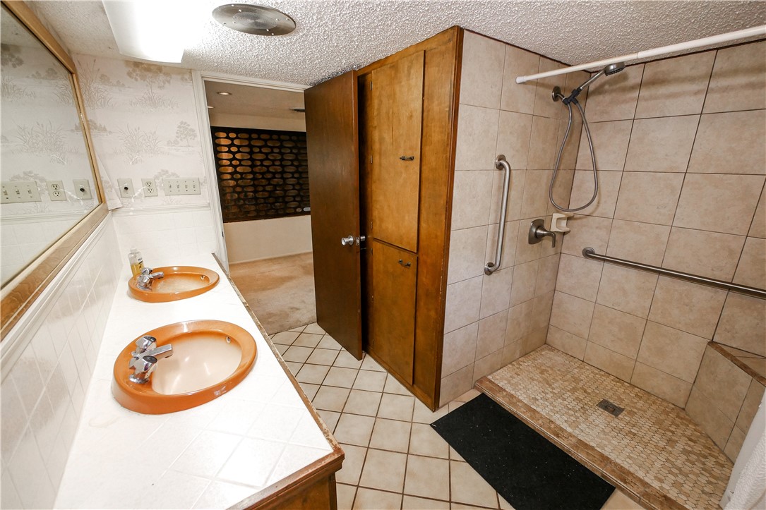 155 Buffalo Road George West, TX 78022 - Photo 24 of 39 a bathroom with a sink a shower and a mirror