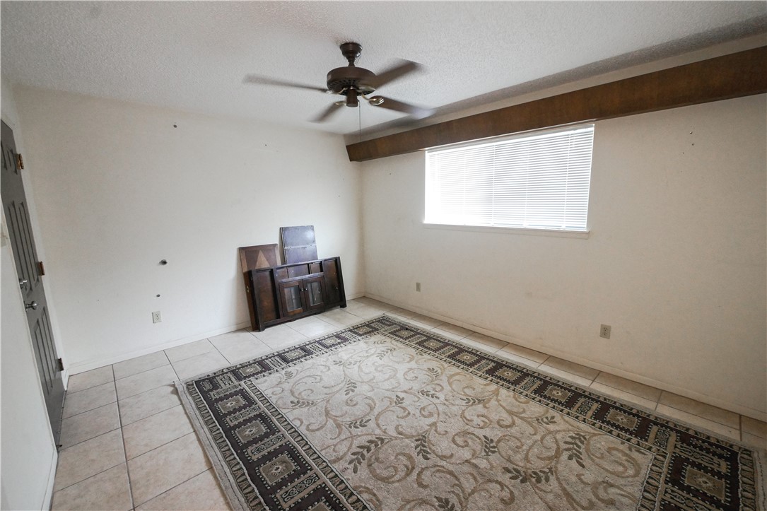 155 Buffalo Road George West, TX 78022 - Photo 35 of 39 a bedroom with a bed and a window