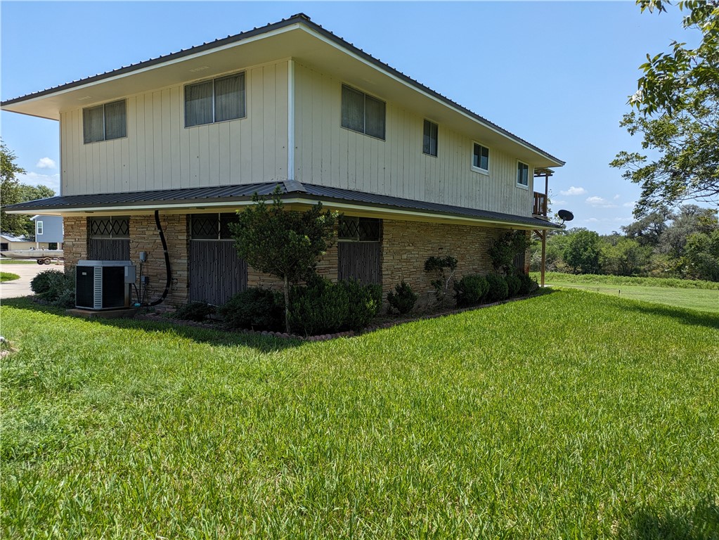 155 Buffalo Road George West, TX 78022 - Photo 5 of 39 a front view of a house with a garden