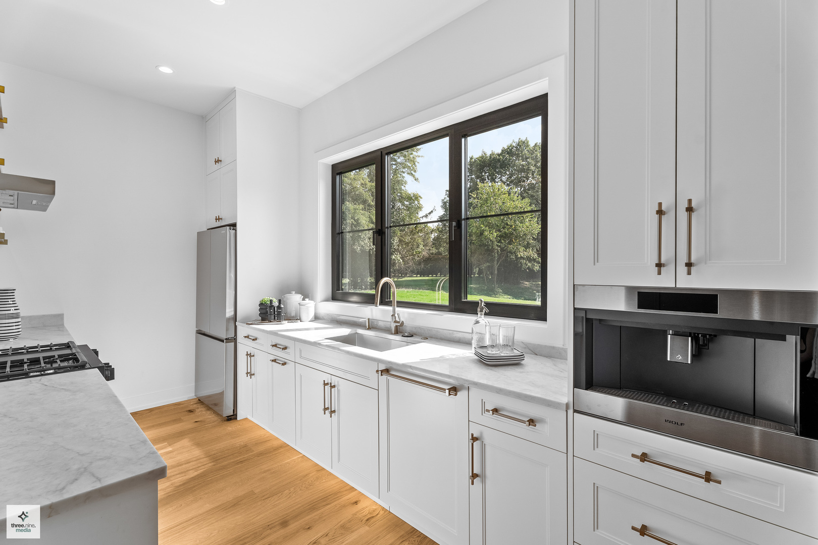 3005 Highland Road Northbrook, IL 60062 - Photo 11 of 68 a kitchen with a sink stove and microwave