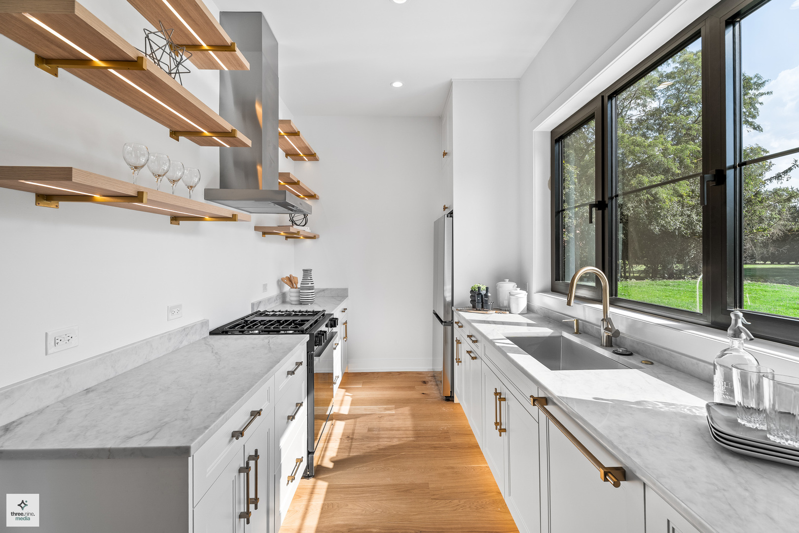 3005 Highland Road Northbrook, IL 60062 - Photo 12 of 68 a kitchen with stainless steel appliances granite countertop a sink and a stove