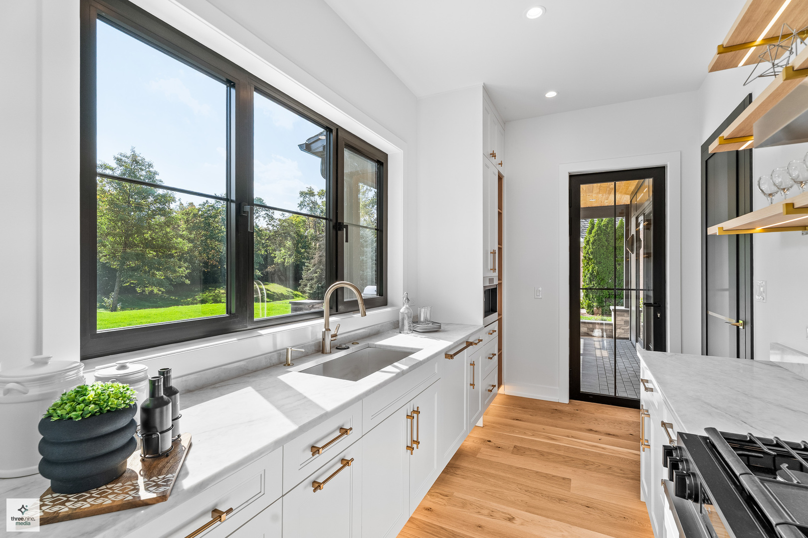3005 Highland Road Northbrook, IL 60062 - Photo 13 of 68 a large kitchen with kitchen island a large window in it