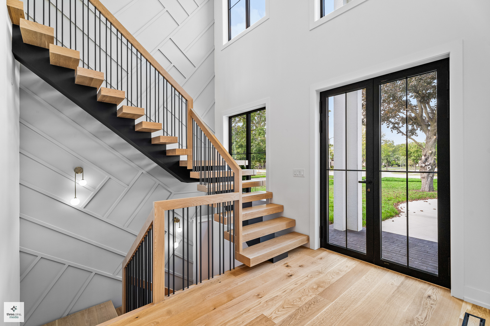 3005 Highland Road Northbrook, IL 60062 - Photo 3 of 68 a view of staircase with wooden floor and white walls