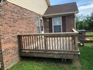 217 Hunter Drive Columbia, TN 38401 - Photo 2 of 7 a view of a wooden chair and fire pit in the backyard