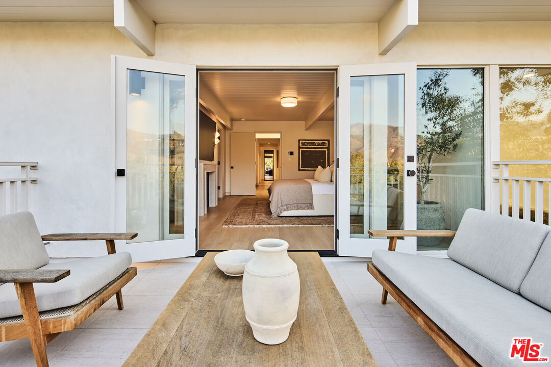 23515 Malibu Colony Road Malibu, CA 90265 - Photo 12 of 22 a living room with furniture and wooden floor