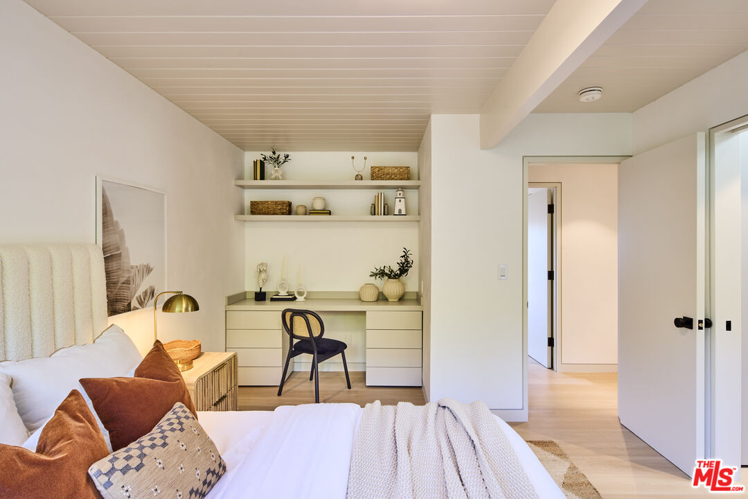 23515 Malibu Colony Road Malibu, CA 90265 - Photo 20 of 22 a bedroom with furniture and a wooden floor