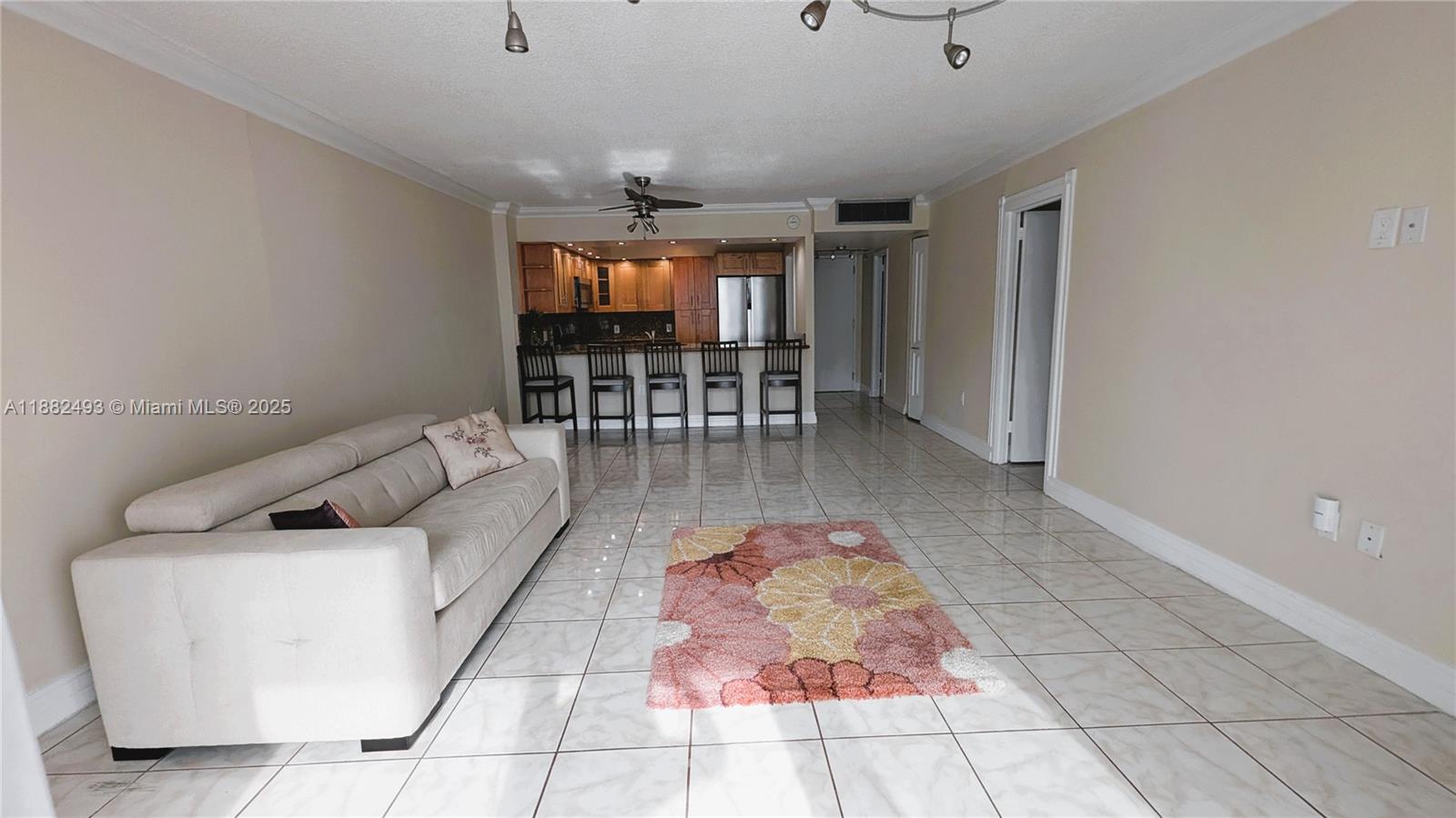 5701 Collins Avenue, Unit 1105 Miami Beach, FL 33140 - Photo 7 of 26 a living room with furniture
