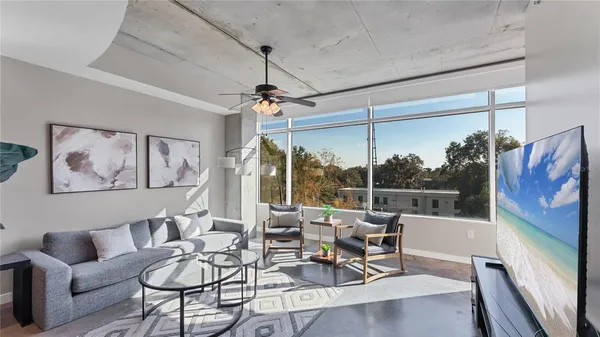 a living room with furniture and a window