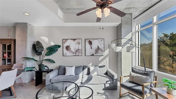 a living room with furniture and white walls