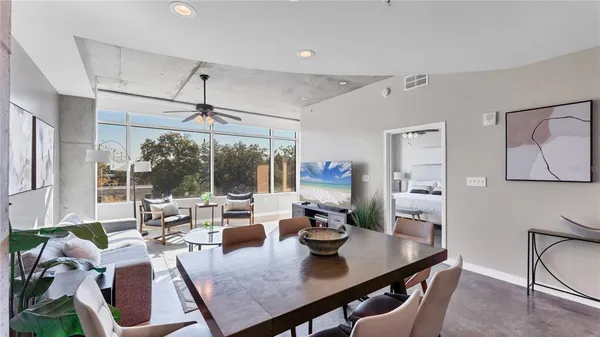 a view of a dining room with furniture window and outside view