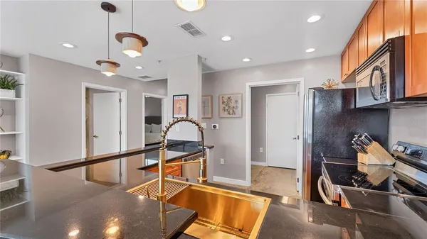 a room with gym equipment and a view of living room