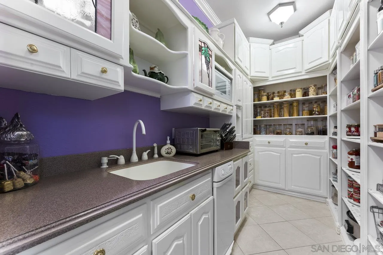 1728 Rancho Judith Alpine, CA 91901 - Photo 15 of 68 a kitchen with a sink cabinets and appliances
