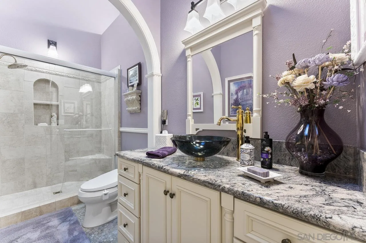 1728 Rancho Judith Alpine, CA 91901 - Photo 17 of 68 a bathroom with a granite countertop sink a toilet and shower