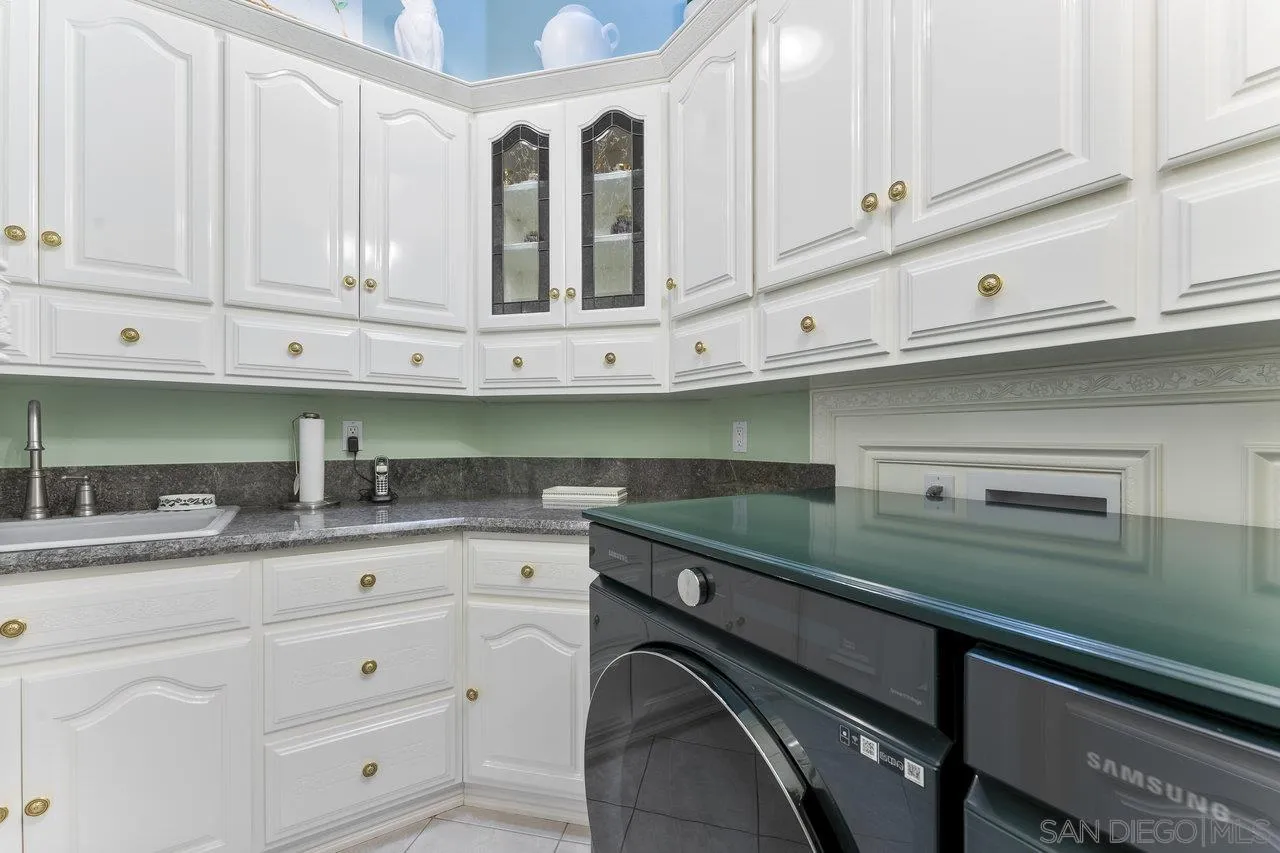 1728 Rancho Judith Alpine, CA 91901 - Photo 24 of 68 a kitchen with granite countertop white cabinets and a sink