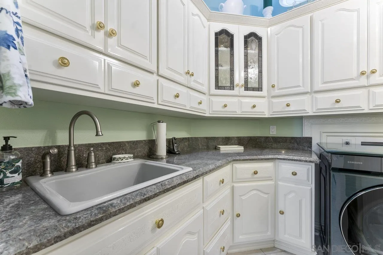 1728 Rancho Judith Alpine, CA 91901 - Photo 25 of 68 a kitchen with granite countertop a sink a stove and cabinets