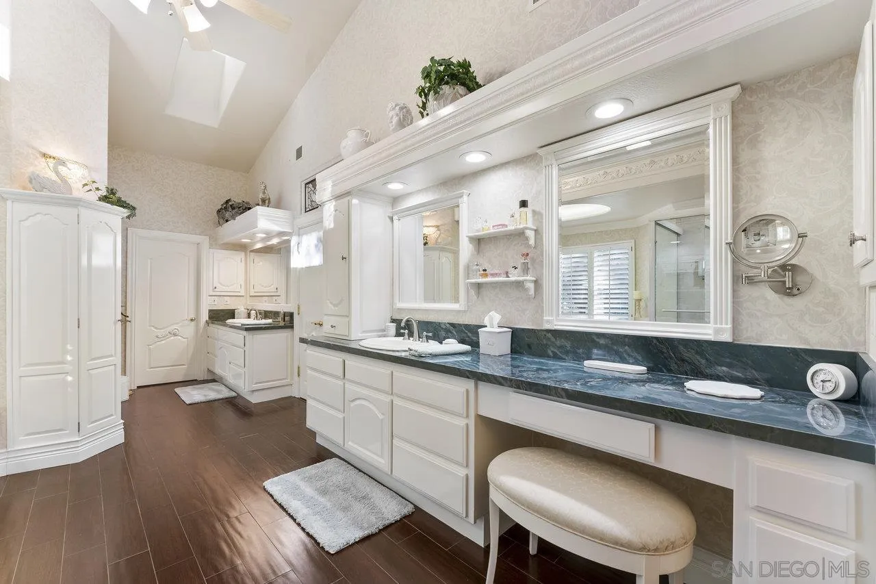 1728 Rancho Judith Alpine, CA 91901 - Photo 28 of 68 a kitchen with granite countertop a sink cabinets and wooden floor
