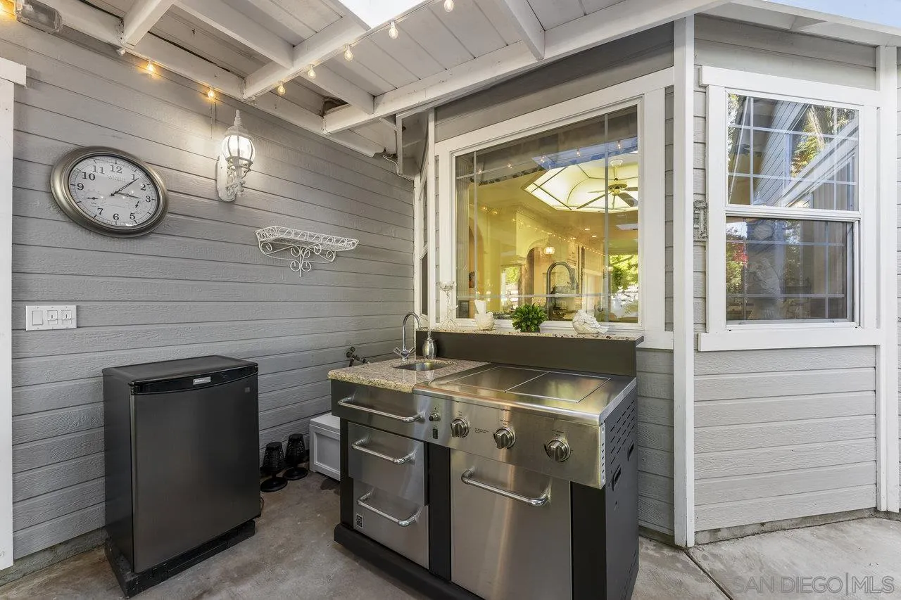 1728 Rancho Judith Alpine, CA 91901 - Photo 64 of 68 a kitchen with a stove and a clock
