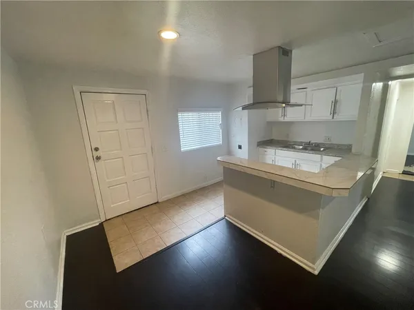 a kitchen with appliances cabinets and a sink
