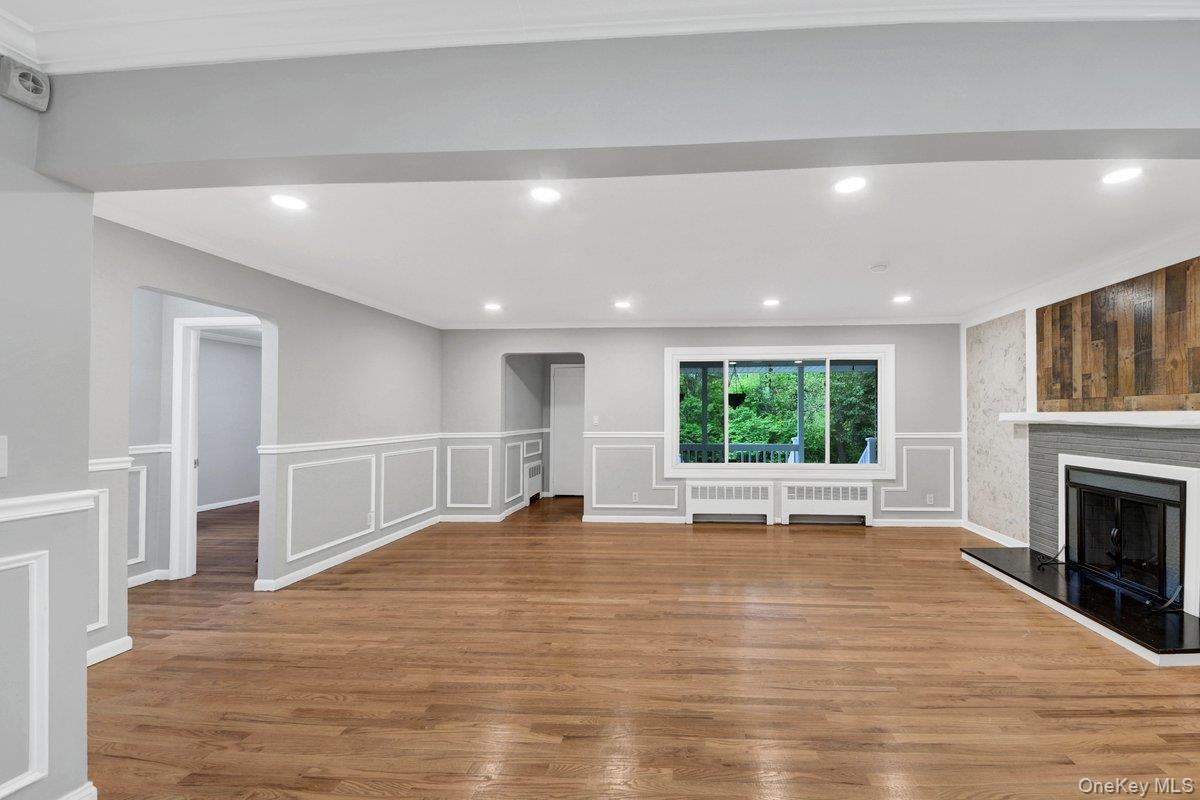 7 Rutledge Road Valhalla, NY 10595 - Photo 7 of 37 Spacious living area featuring wood-finish flooring, recessed lighting, and white crown molding