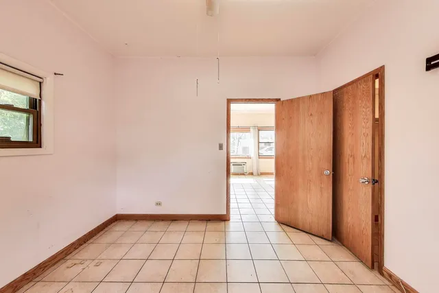 a bathroom with a tub a toilet and a shower