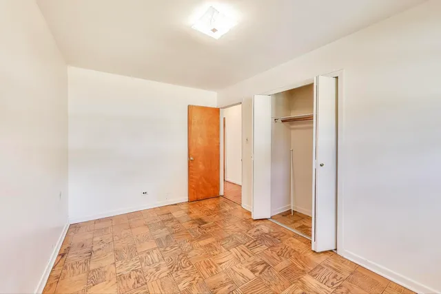 a bathroom with a shower a toilet and a shower