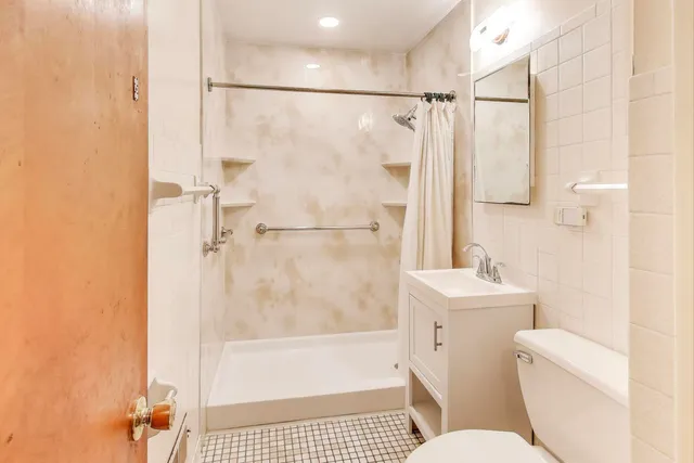 a view of storage and utility room with a washer and dryer