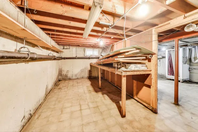 a view of a backyard with table and chairs and potted plants